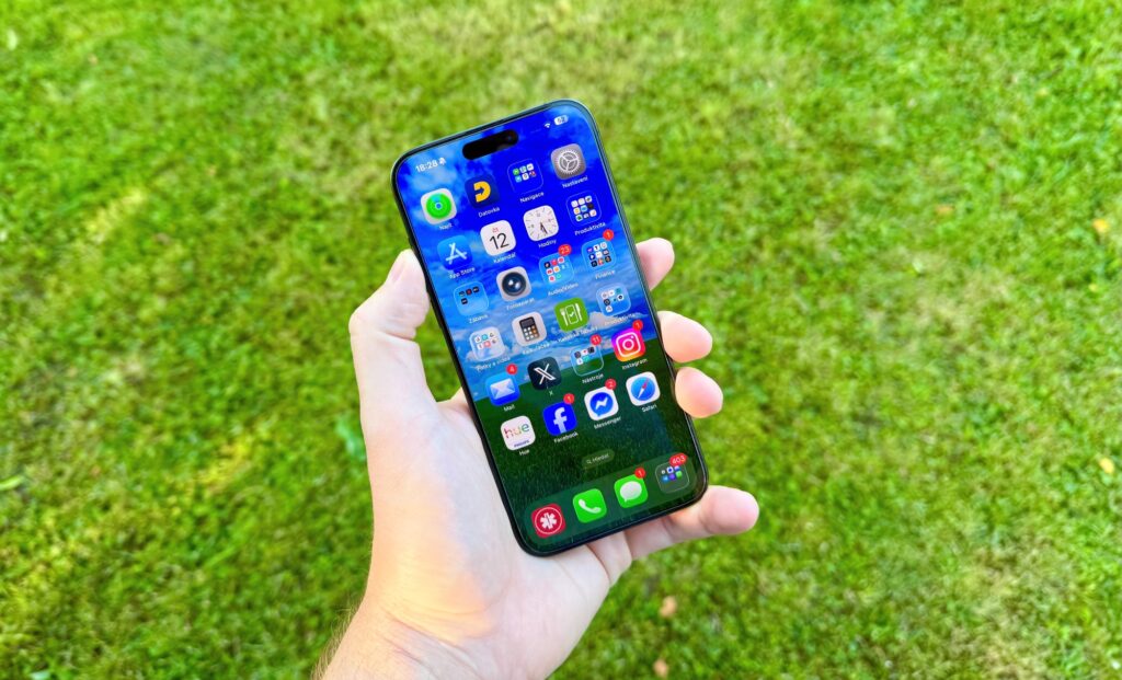 a hand holding a cell phone